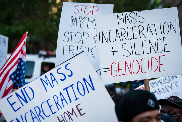 Photo of protest in NYC with signs calling for the end of mass incarceration. 